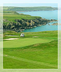 A golf cart moves around the greens